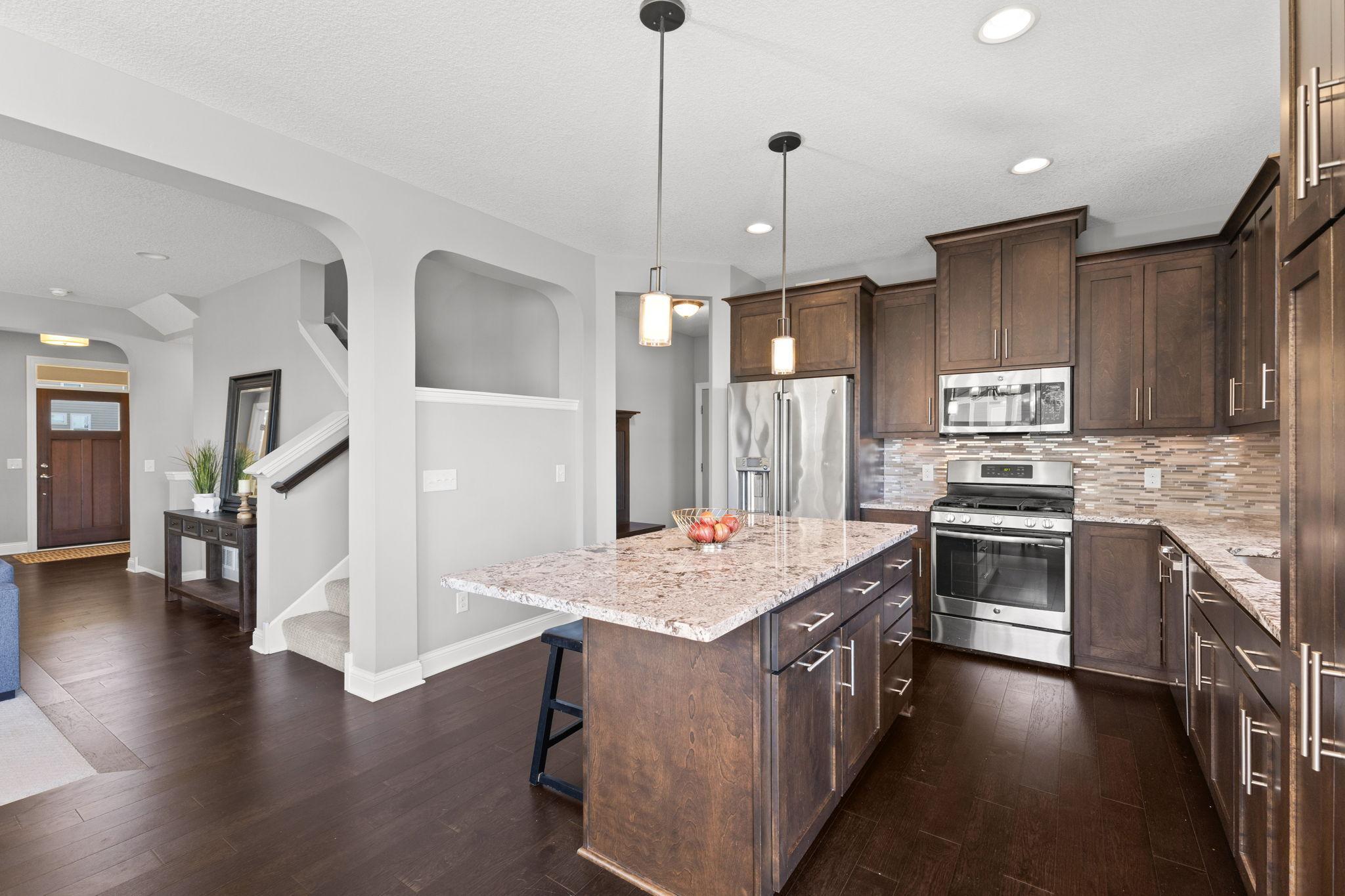 Kitchen leads to Mud Room and Powder Bath