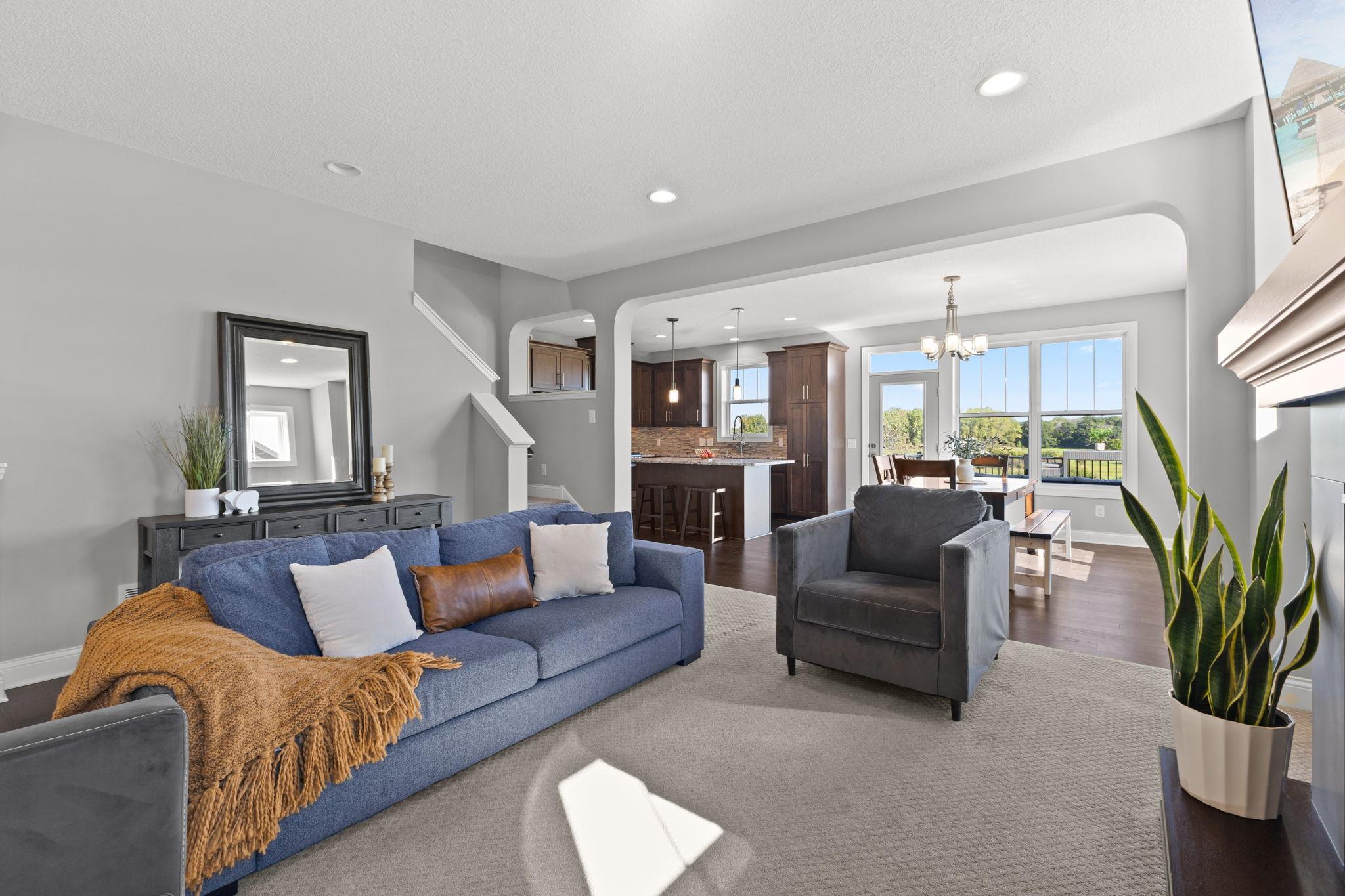 Living Room opens to Dining and Kitchen