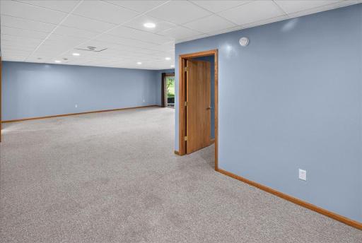 Big, open and versatile, this lower-level family room has room for it all.