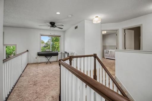 Versatile upper-level loft adds another flexible living area to the home.