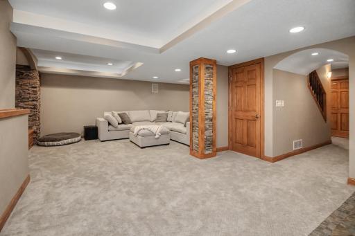 Downstairs, the finished lower level provides a spacious family room for movie nights and entertaining.