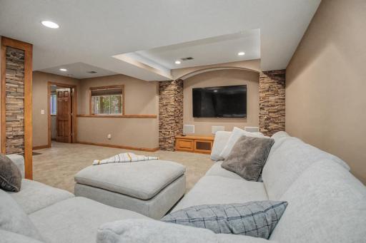 Plenty of room downstairs to create separate areas for lounging, games and entertainment.