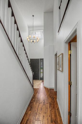 Two-story foyer creates a bright and impressive welcome into the home.