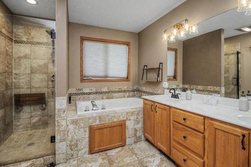 Another stunning space! Relax in the primary bath featuring a jetted tub, separate shower and dual sink vanity.