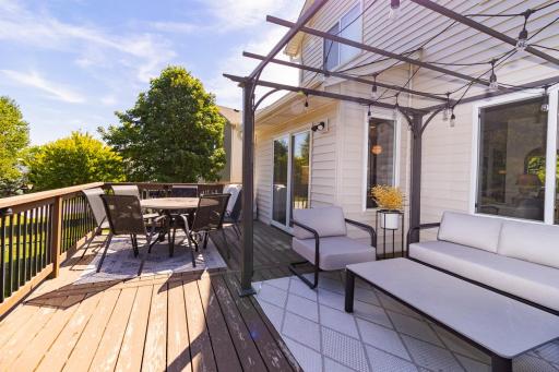 Step outside to a large deck with multiple areas for dining, lounging and entertaining.