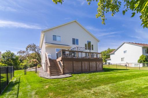 Large backyard deck extends the living space outdoors.
