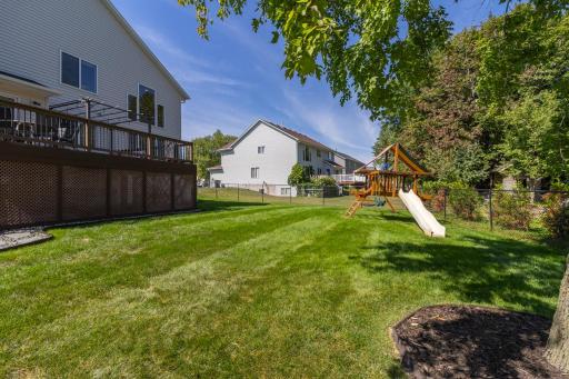 Fenced backyard offers a generous lawn with room for play, pets and outdoor activities.