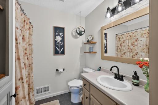 Private bath adds everyday convenience to the upper-level suite.
