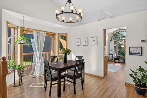 Sliding glass doors fill the dining area with natural light and provide direct access to the deck.