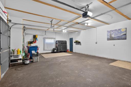 Huge 3-stall garage with plenty of room for vehicles, toys, gear, and extra storage.