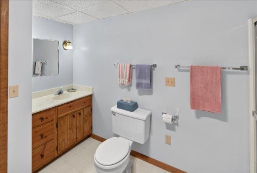 Vanity with marble counter top and large mirror