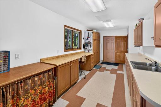 Enter this hobby room from the garage if that is more conveneient or front the main house. Great storage room for household projects or fun ideas!