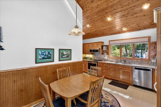 Updated Kitchen with Granite Countertops and Extensive Wood Cabinetry