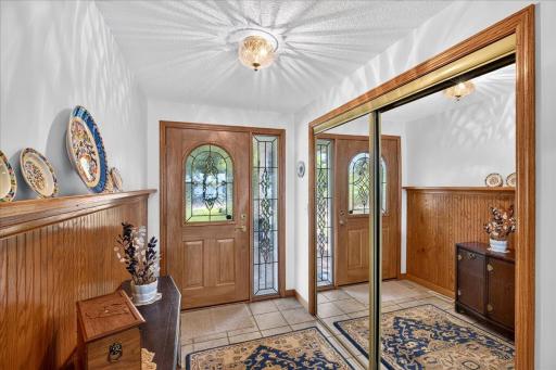Welcoming Entry with Warm Woodwork at 12500 Melody Lane in Lindstrom MN