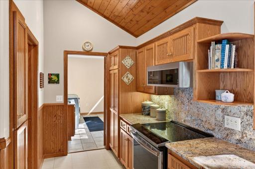 Main-Level Laundry Room with Cabinet Storage and Utility Sink