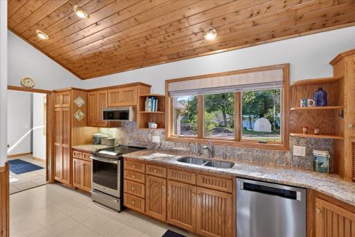 Granite Countertops, Stainless Appliances and Natural Wood Cabinets