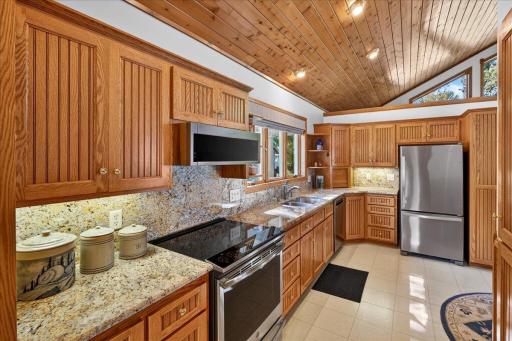 Granite Kitchen with Abundant Cabinet Storage at 12500 Melody Lane