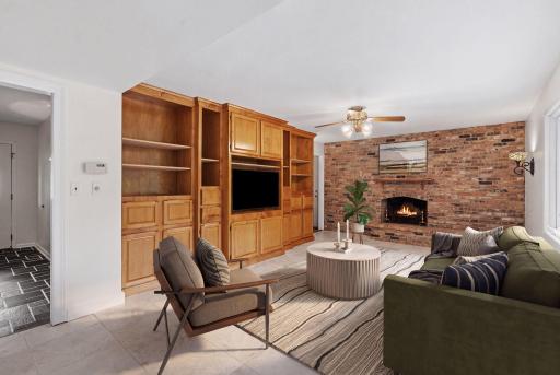 Virtually Staged Family room with brick wood-burning fireplace