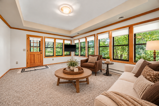 Virtually Staged Four season porch to enjoy Millers woods.