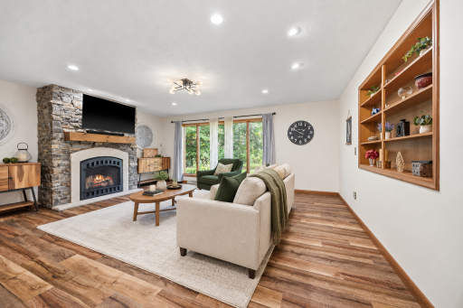 Virtually Staged Living room with gorgeous stone gas fireplace