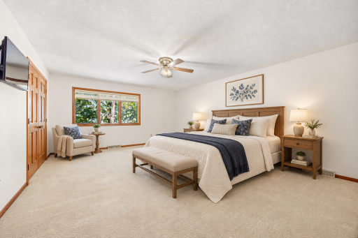 Virtually Staged Primary Bedroom with nice walk in closet