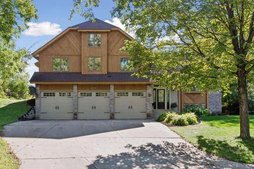 Private wooded setting surrounds this spacious three-level split home with mature trees, 4-car garage and beautiful natural surroundings.