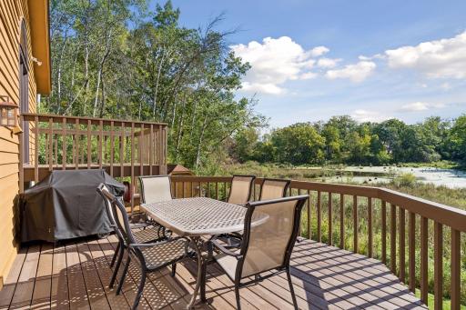 Large deck overlooking the pond and wildlife - a great outdoor space for dining, entertaining, or relaxing.