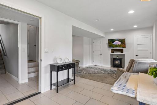 Spacious lower-level living area offers the flexibility of a private mother-in-law suite, complete with its own kitchen, laundry, bath, and walkout access.