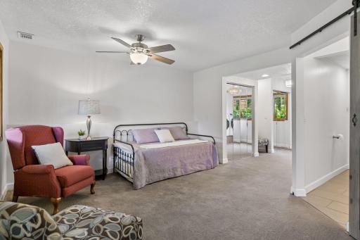 Generously sized lower-level bedroom provides comfortable private space within the mother-in-law suite.