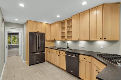 Updated eat in kitchen with granite, new appliances, plenty of cabinet space.