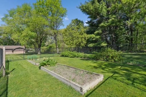 Fenced vegetable garden, perfect for growing fresh produce and herbs.