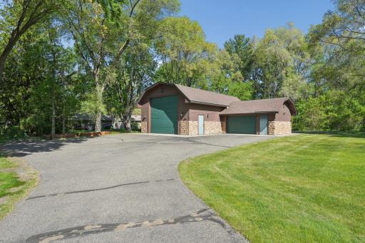 A separate 1,440 sq ft detached garage is equally impressive, with heated floors, A/C, insulation, 1/4 bath, floor drain, cable TV, internet, and a security system