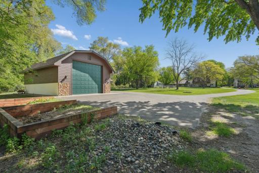 Another view of the separate 1,440 sq ft detached garage is equally impressive, with heated floors, A/C, insulation, 1/4 bath, floor drain, cable TV, internet, and a security system