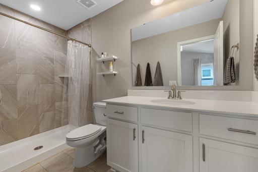Primary master bathroom, connected to the bedroom and features a beautiful stand up tile shower.