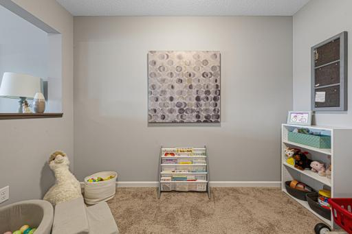 Additional office space on the upper level, currently used as a kids area.