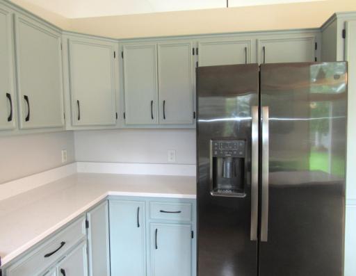 Beautiful neutral colored quartz counter tops. There is also under cabinet lighting (with charger).
