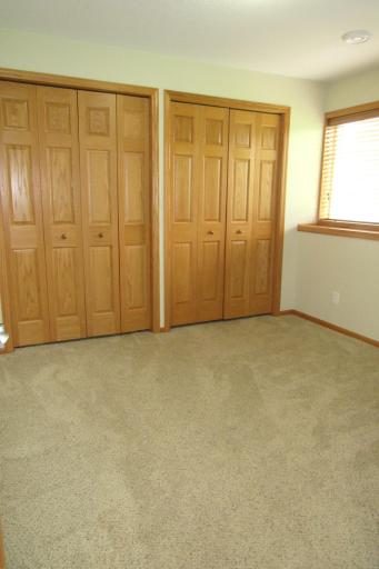 Lower level bedroom or craft room. The day window lets in natural light and there is also ceiling lighting.