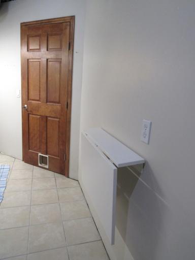 Fold down folding table in the laundry room.