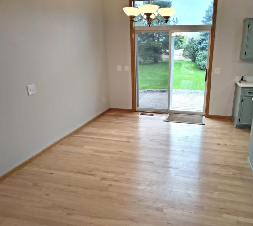Huge dining space with refinished hardwood floors, 12 foot ceilings and open to the kitchen. Patio doors lead to the expansive rear yard and paver patio.