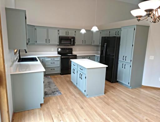 Center island with great storage and pendant lighting above.
