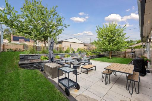Mature landscaping gives the backyard a private, established feel.