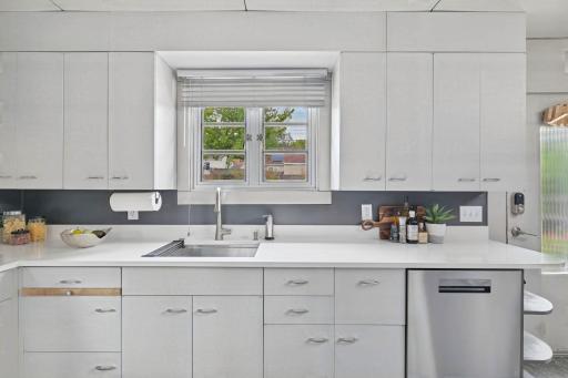 Updated appliances and metal cabinetry bring a fresh, functional approach to the kitchen.