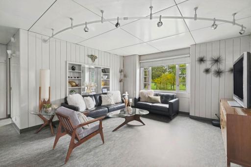 Clean mid-century lines and an exceptionally well-kept exterior set the tone.