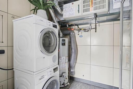 Convenient in-home laundry is neatly integrated into the utility space.