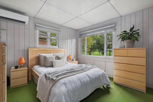 Original wall panels and green flooring create a distinctly vintage feel.