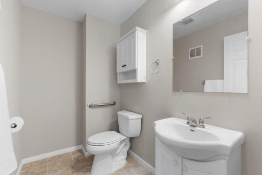 Convenient private ensuite half-bath off the primary suite.