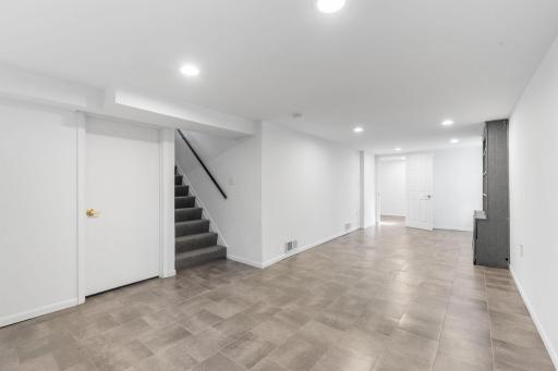 Expansive lower-level family room perfect for movie nights, home gym, or recreation space.