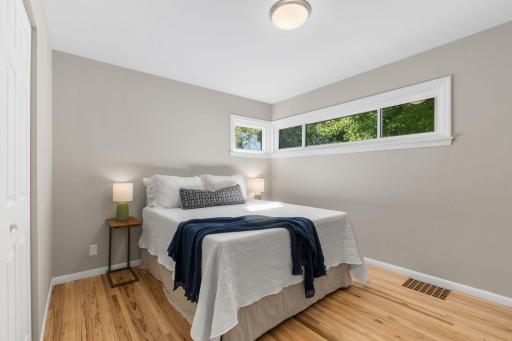 Sizable second bedroom with large closet, neutral decor, and versatile layout.