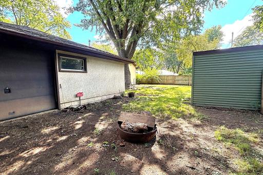 Pull through garage and fire pit area.
