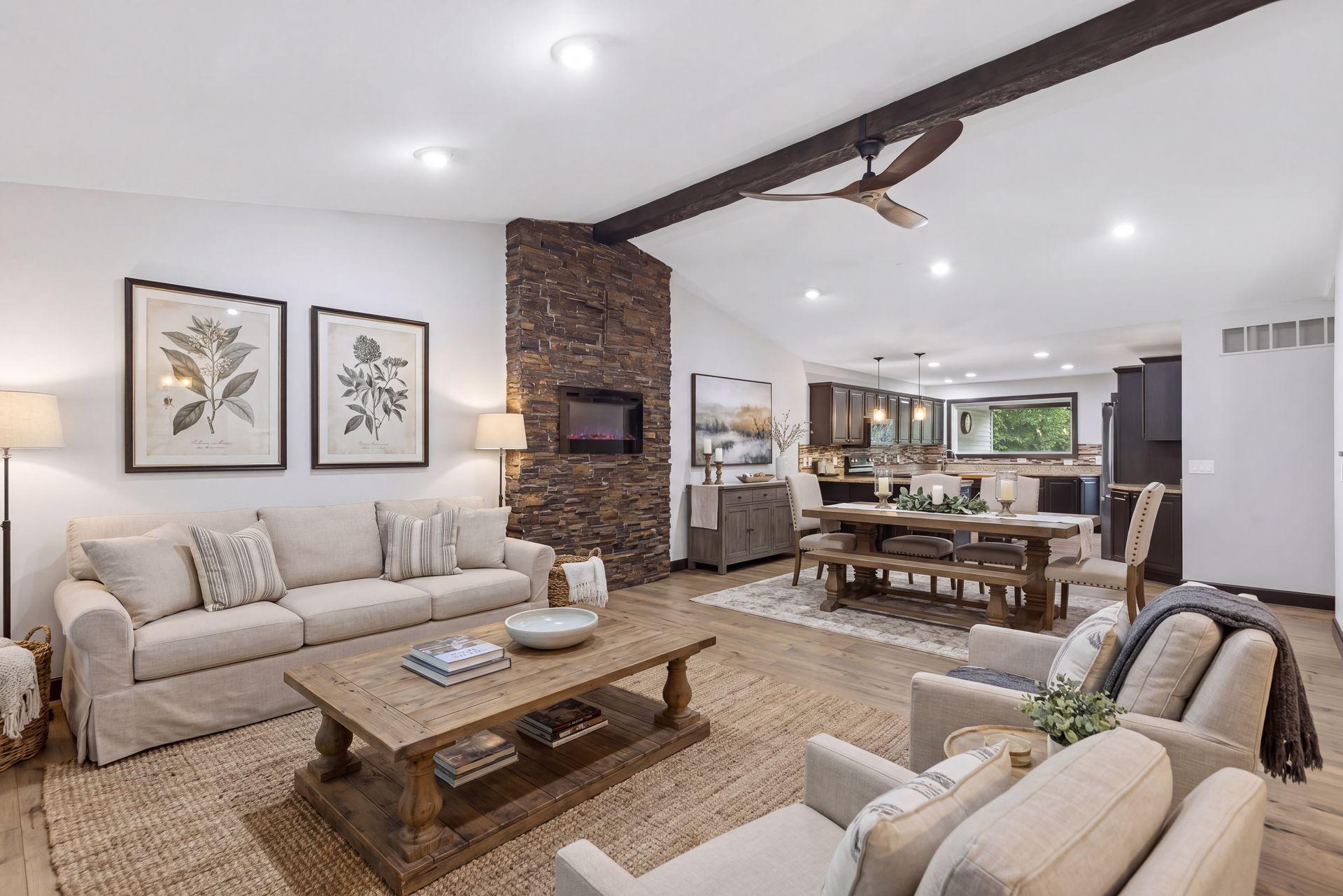 The open layout connects the living room, dining area, and kitchen, creating a comfortable setting for daily living and entertaining.